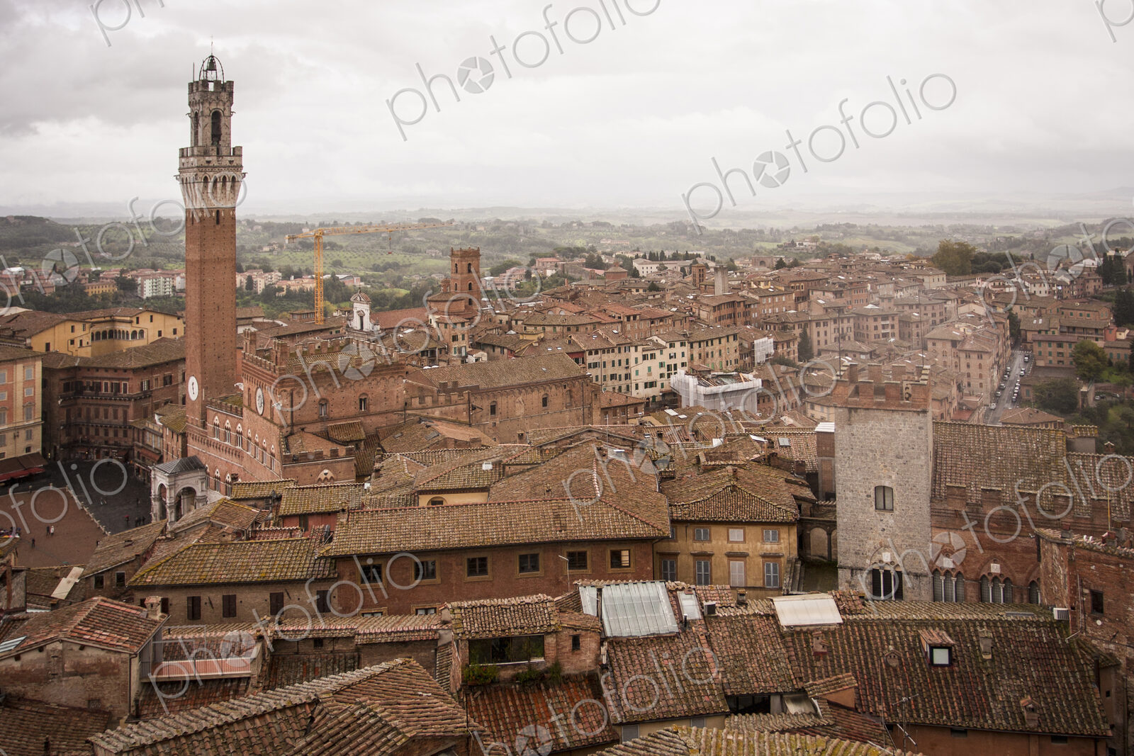 High angle view across the city of Siena with the Piazza del Campo and Torre del…