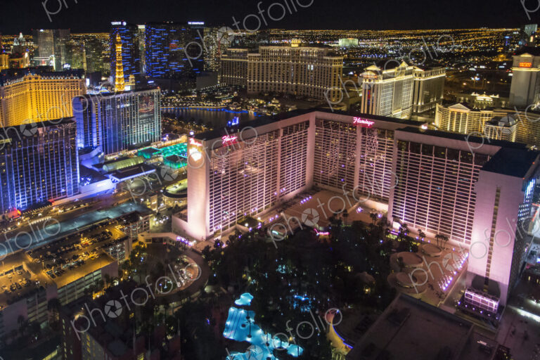 High angle view of Las Vegas at night, with the illuminated Flamingo hotel and casino…