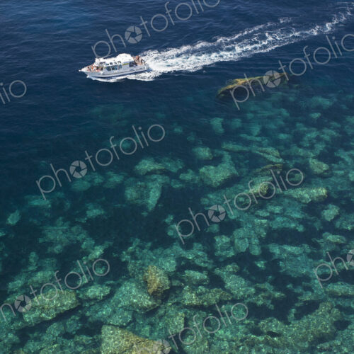 High angle view of a cruise ship on the calm clear waters of the Mediterranean. High angle view of a cruise ship on the calm clear waters of the Mediterranean.