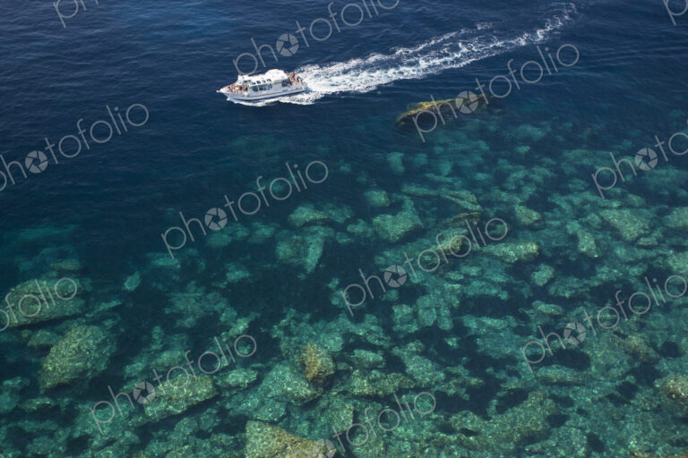 High angle view of a cruise ship on the calm clear waters of the Mediterranean.
