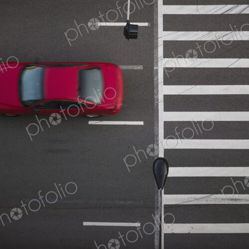 High angle view of car driving on street High angle view of car driving on street
