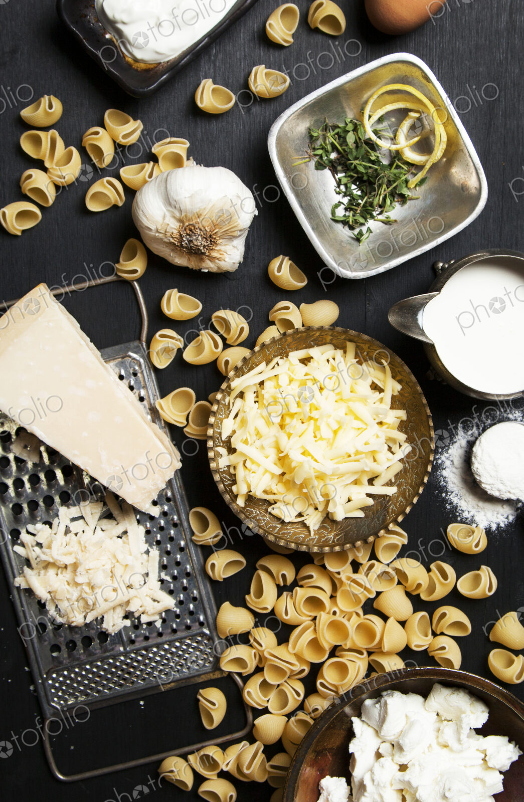 High angle view of cheese and pasta ingredients