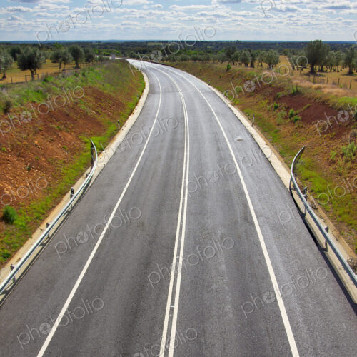 High angle view of freshly spread asphalt on a two lane road in the Alentejo region.