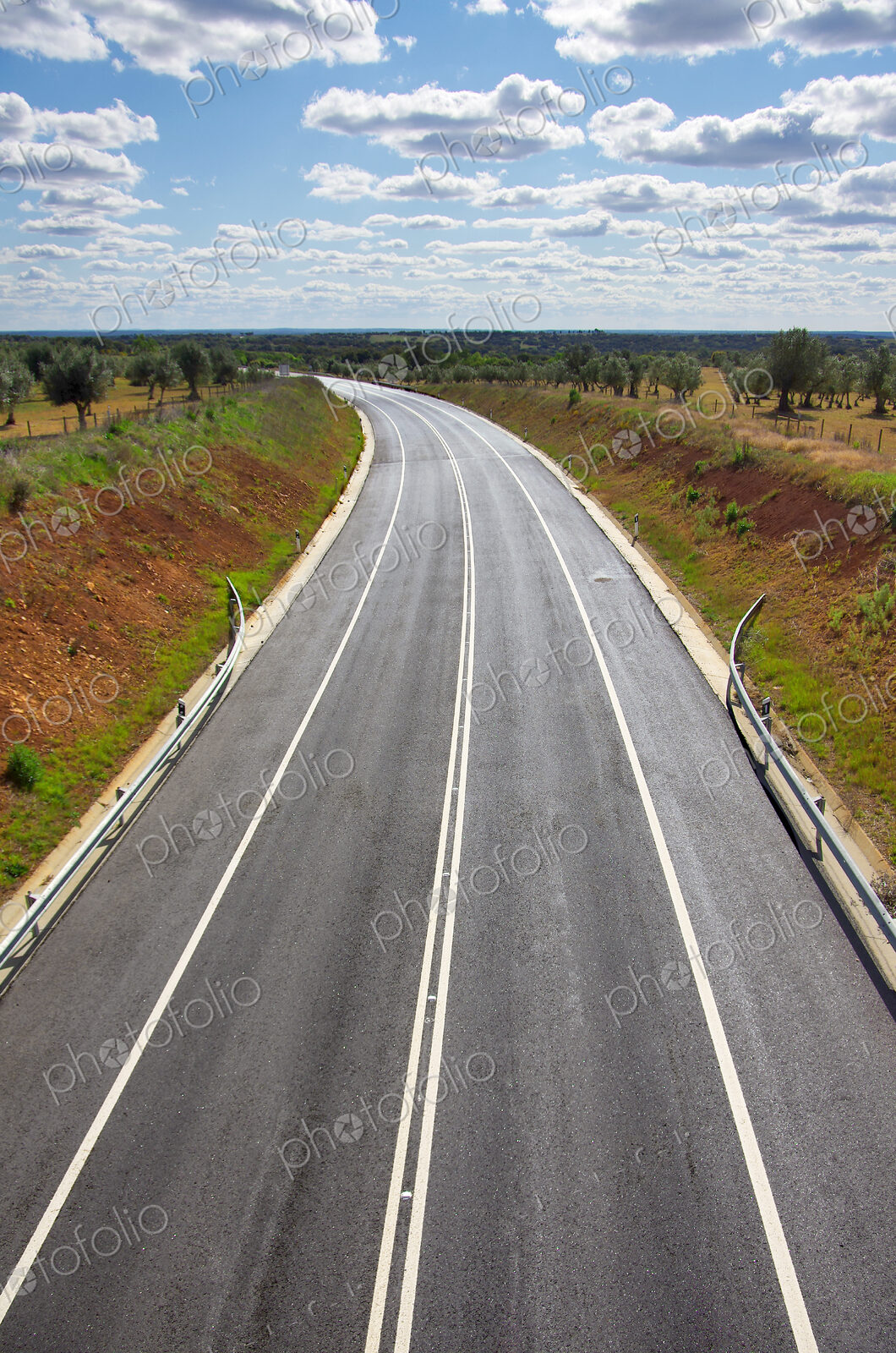 High angle view of freshly spread asphalt on a two lane road in the Alentejo region.