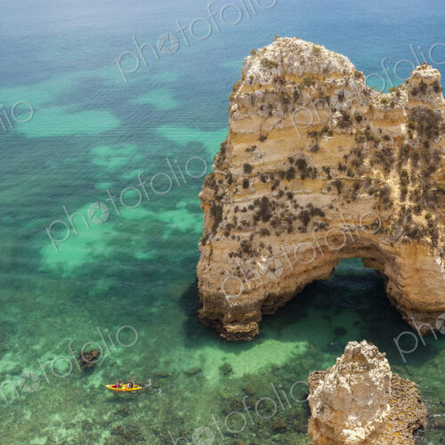 High angle view of rock formation in clear ocean.