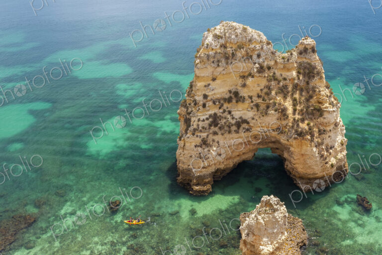 High angle view of rock formation in clear ocean.