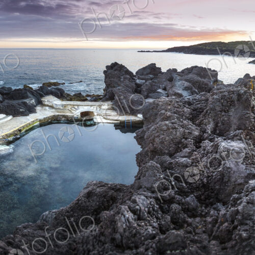 High angle view of rock formations in beach