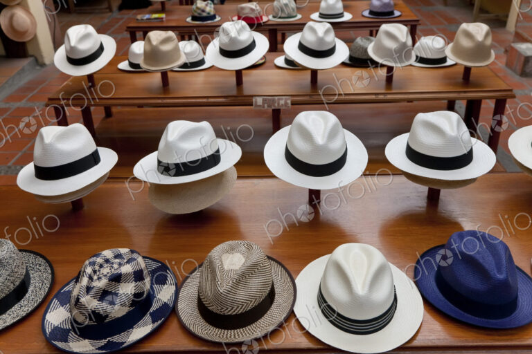 High angle view of rows of Panama hats on display in a shop.