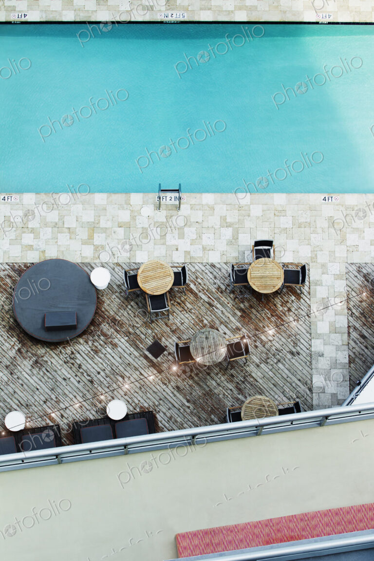 High angle view of tables at hotel swimming pool