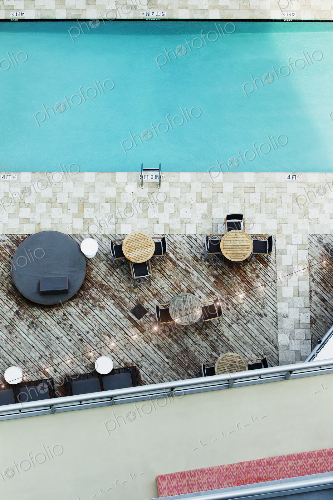 High angle view of tables at hotel swimming pool
