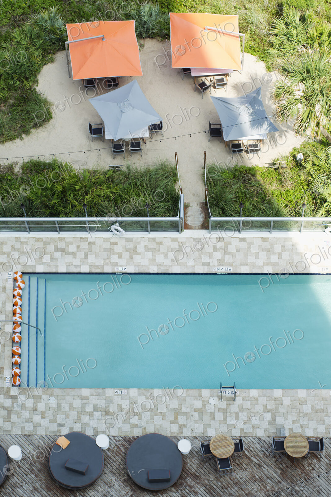 High angle view of tables at hotel swimming pool