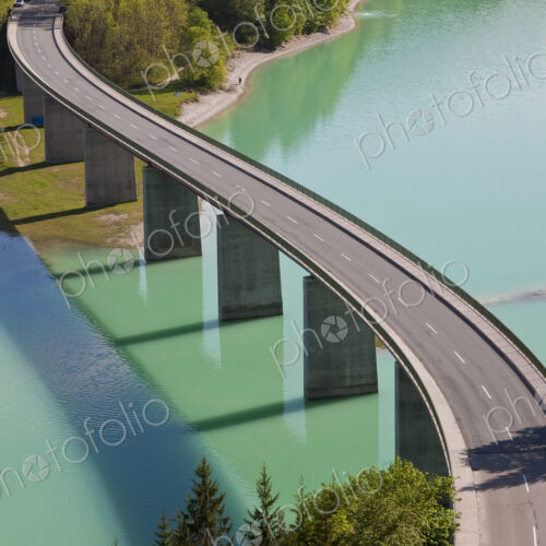 High angle view of tall road bridge crossing dam High angle view of tall road bridge crossing dam