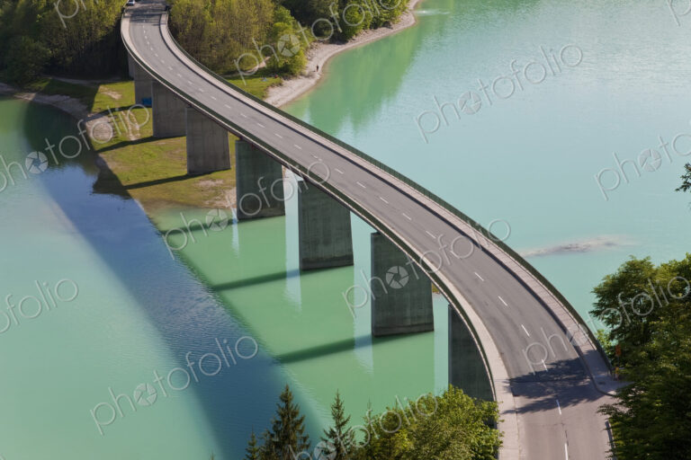 High angle view of tall road bridge crossing dam