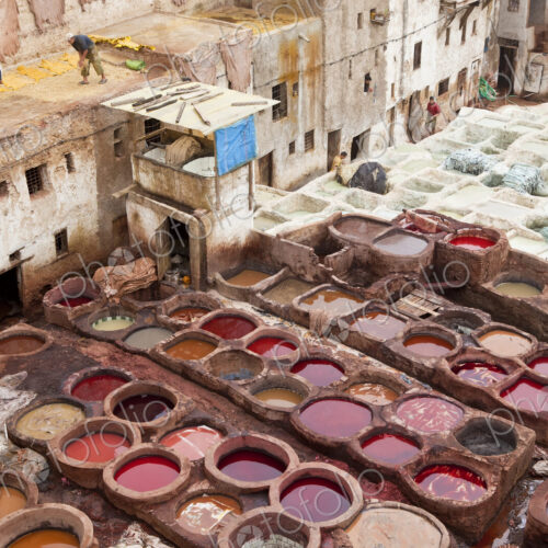 High angle view over medieval, traditional North African tannery. High angle view over medieval, traditional North African tannery.
