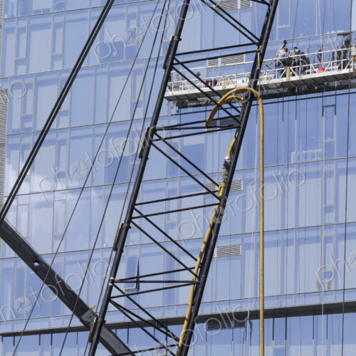 Highrise window washers on scaffolding