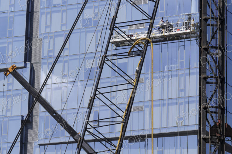 Highrise window washers on scaffolding