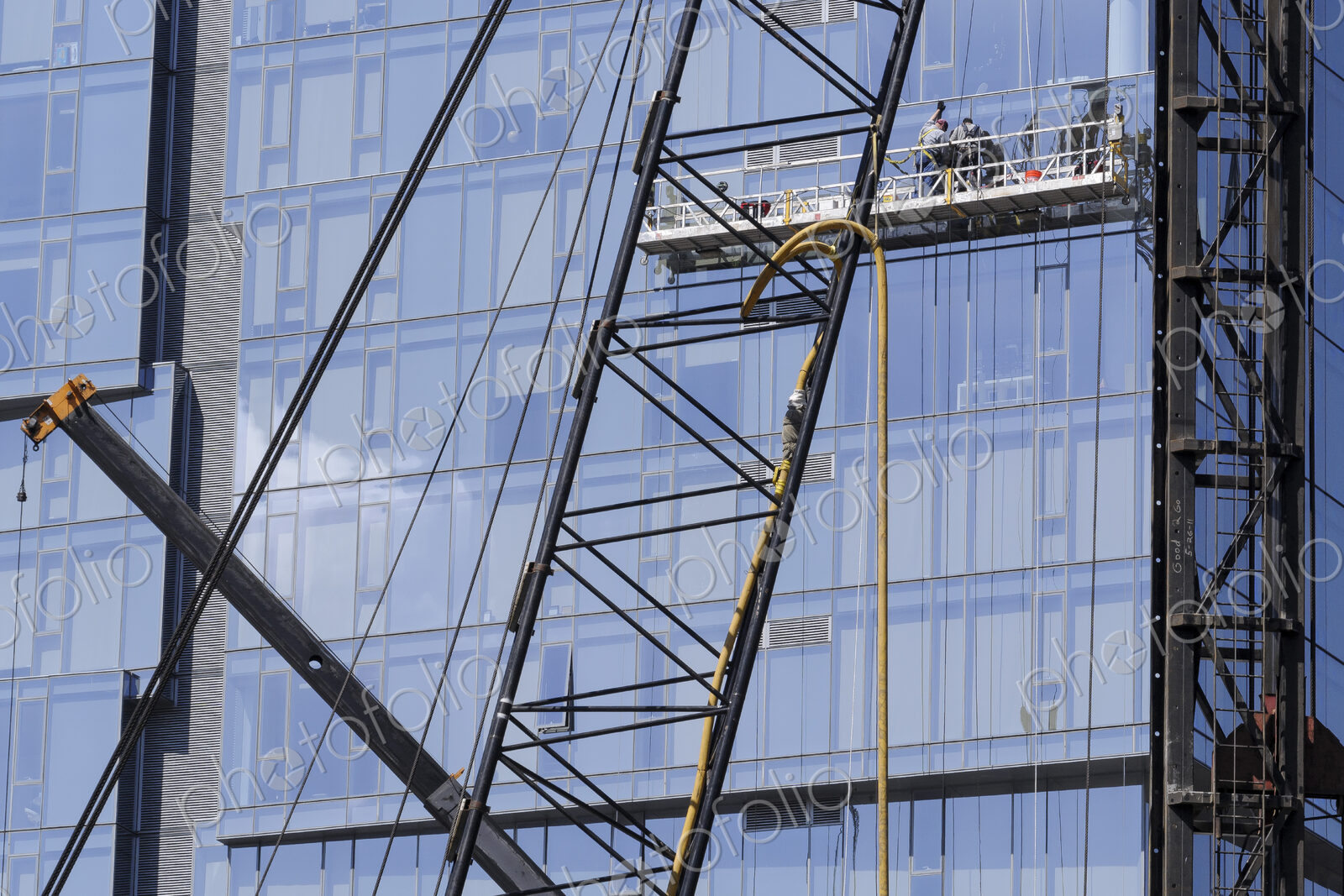 Highrise window washers on scaffolding