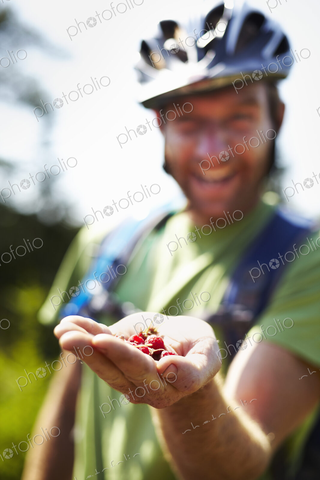 Hiker on Trail with Native Raspberries