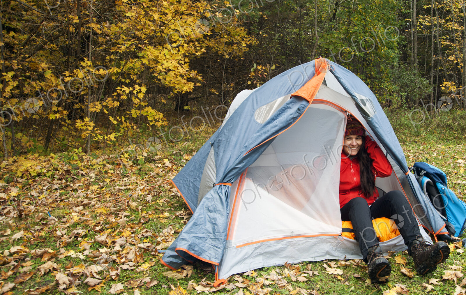 Hiker sitting in tent at campsite