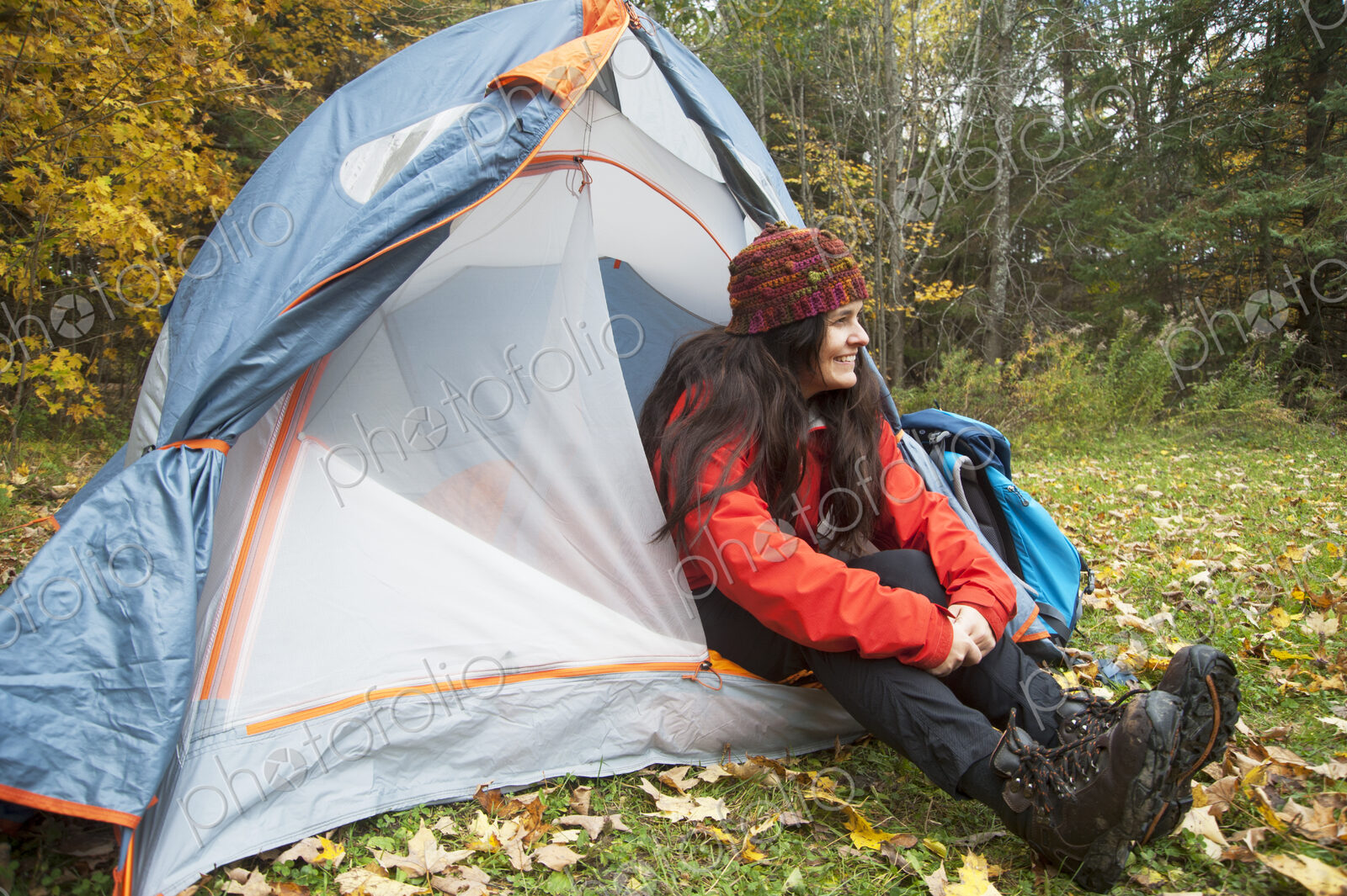 Hiker sitting in tent at campsite