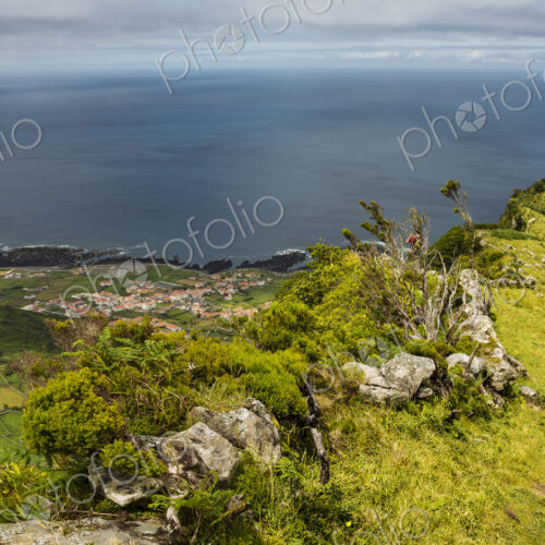 Hiker walking on hilltop path in rural landscape Hiker walking on hilltop path in rural landscape