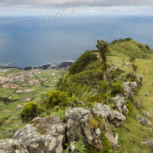 Hiker walking on hilltop path in rural landscape Hiker walking on hilltop path in rural landscape