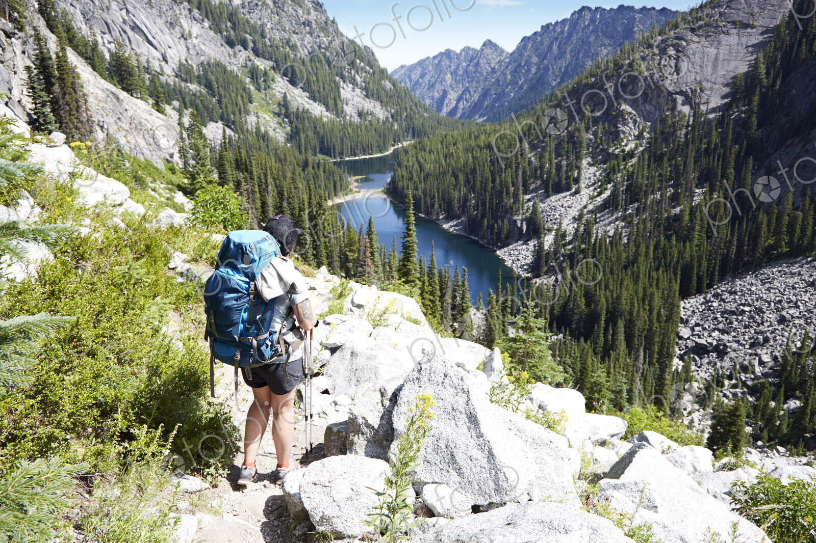 Hiker walking on rocky hillside