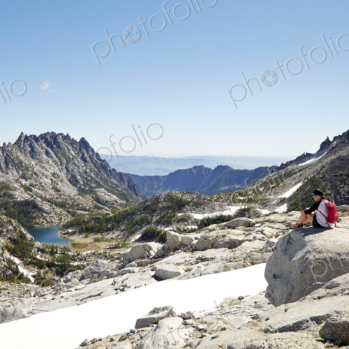 Hikers admiring mountains in remote landscape Hikers admiring mountains in remote landscape