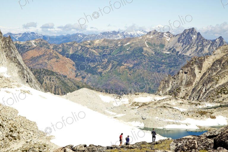 Hikers admiring mountains in remote landscape
