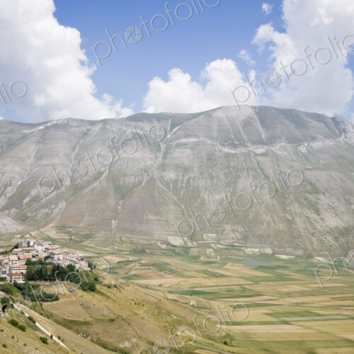 Hilltop Town With Mountain in Background