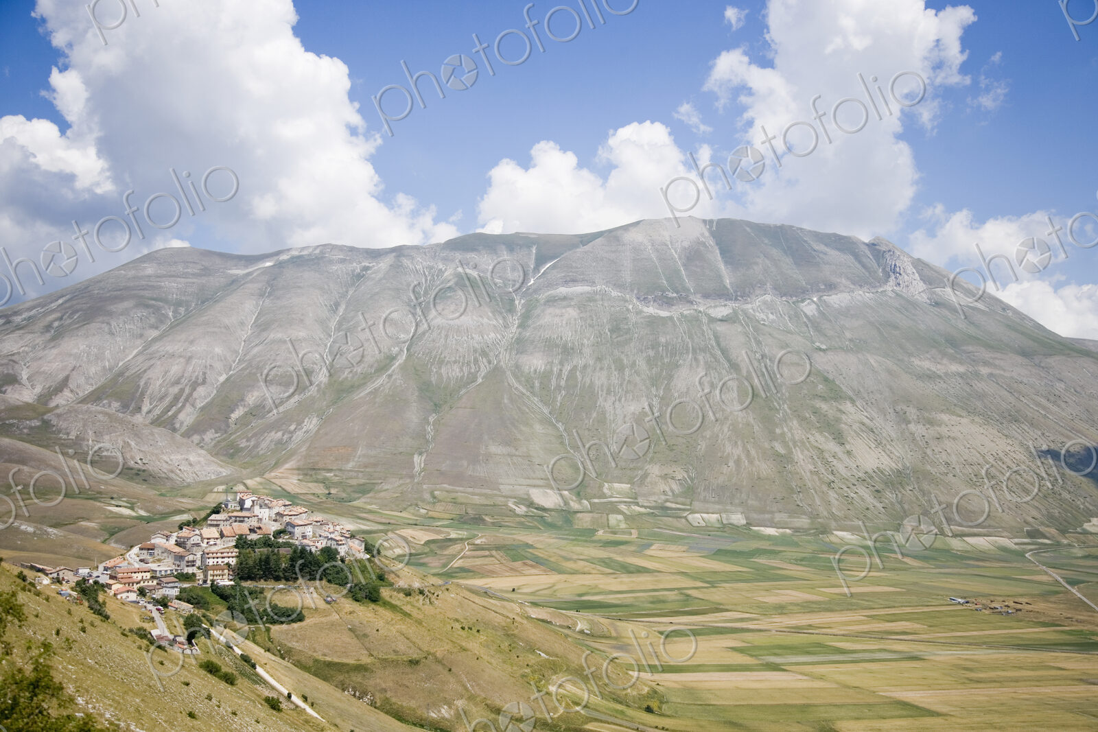 Hilltop Town With Mountain in Background