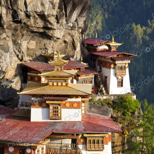 Himalayan Buddhist sacred site, temple complex perched on a ledge on a cliff Himalayan Buddhist sacred site, temple complex perched on a ledge on a cliff