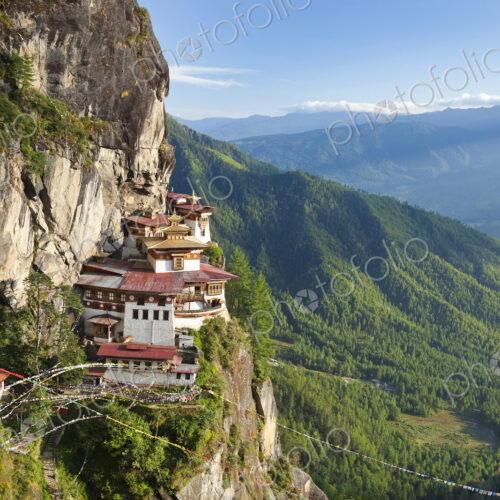Himalayan Buddhist temple complex perched on a vertical rockface. Himalayan Buddhist temple complex perched on a vertical rockface.