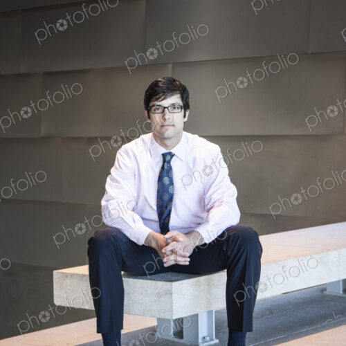 Hispanic business man in an office lobby. Hispanic business man in an office lobby.