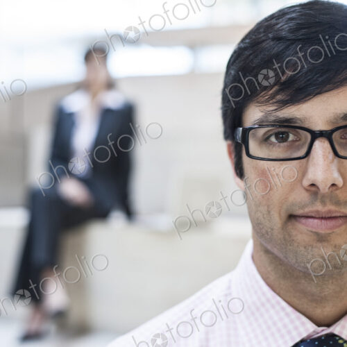 Hispanic business man in an office lobby. Hispanic business man in an office lobby.