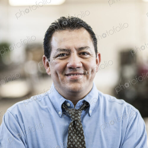 Hispanic man manager in a sheet metal factory.