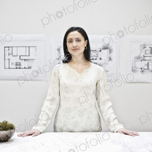 Hispanic woman in an architect's office. Hispanic woman in an architect's office.
