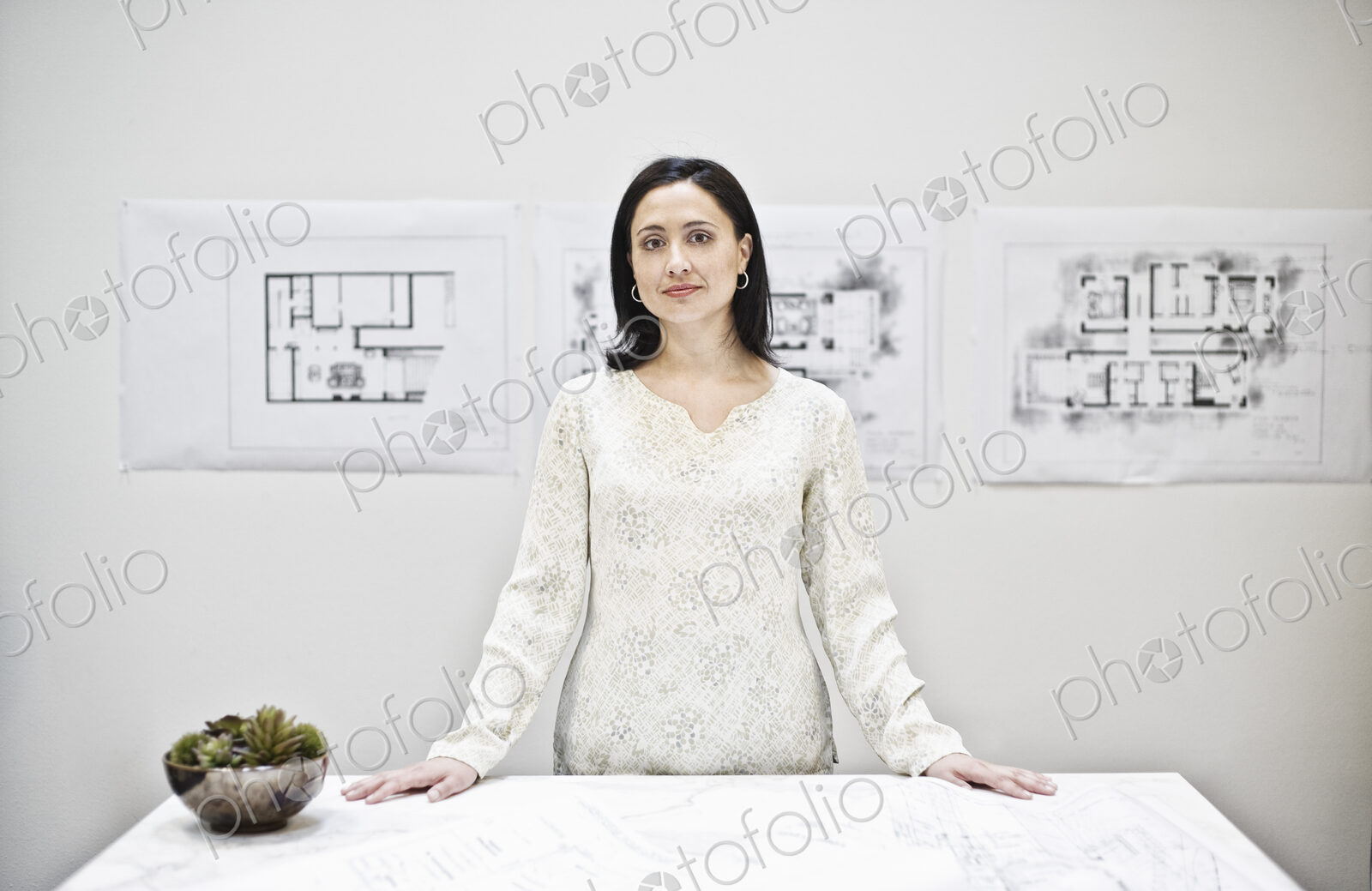 Hispanic woman in an architect’s office.