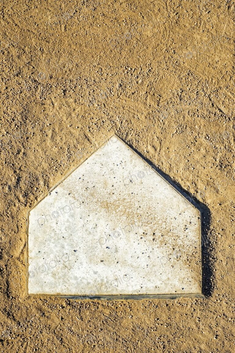 Home Plate on Baseball Field covered with dirt, top view