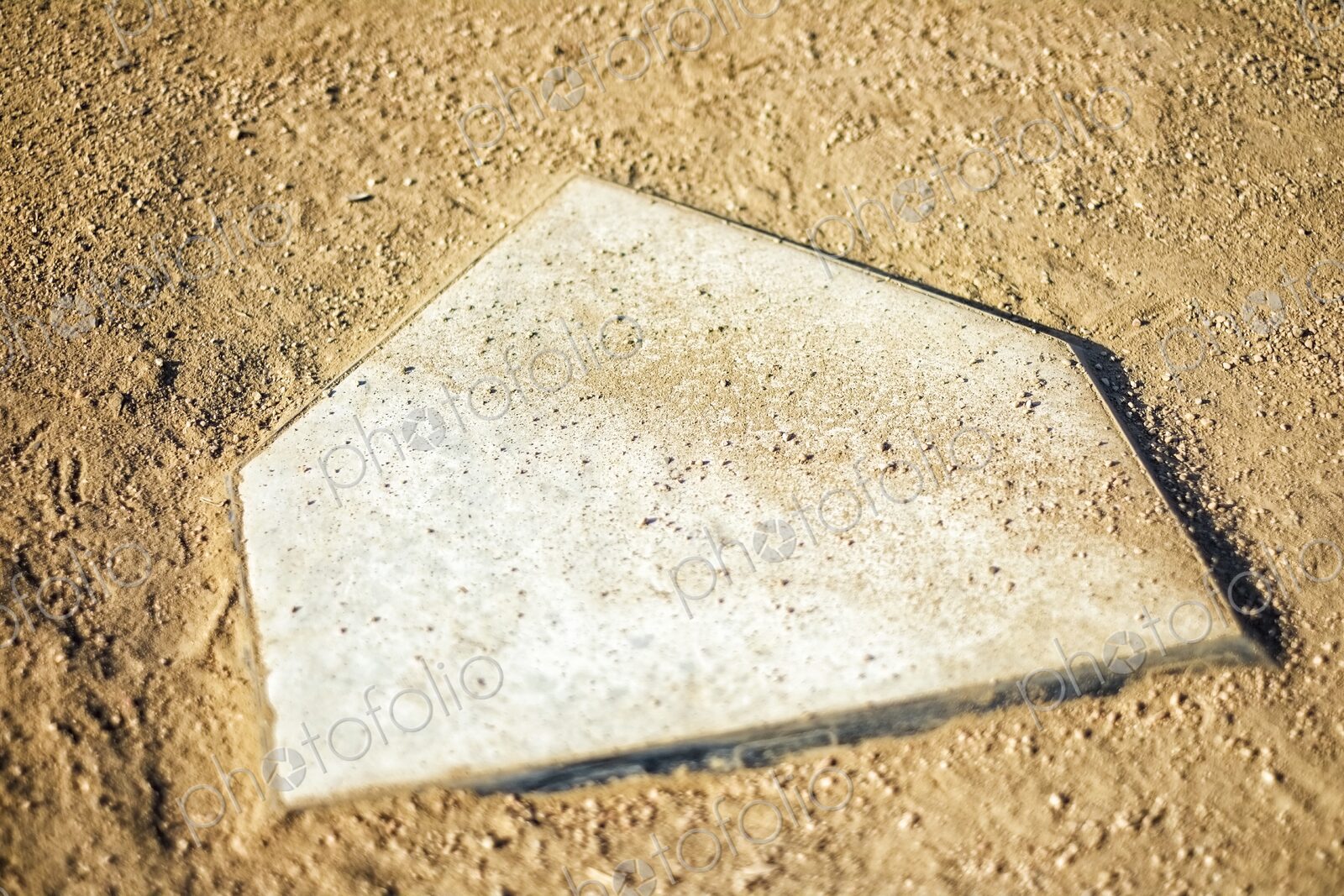 Home Plate on Baseball Field covered with dirt, top view