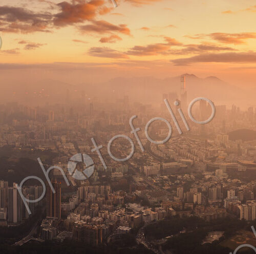 Hong Kong cityscape lit up at dawn.