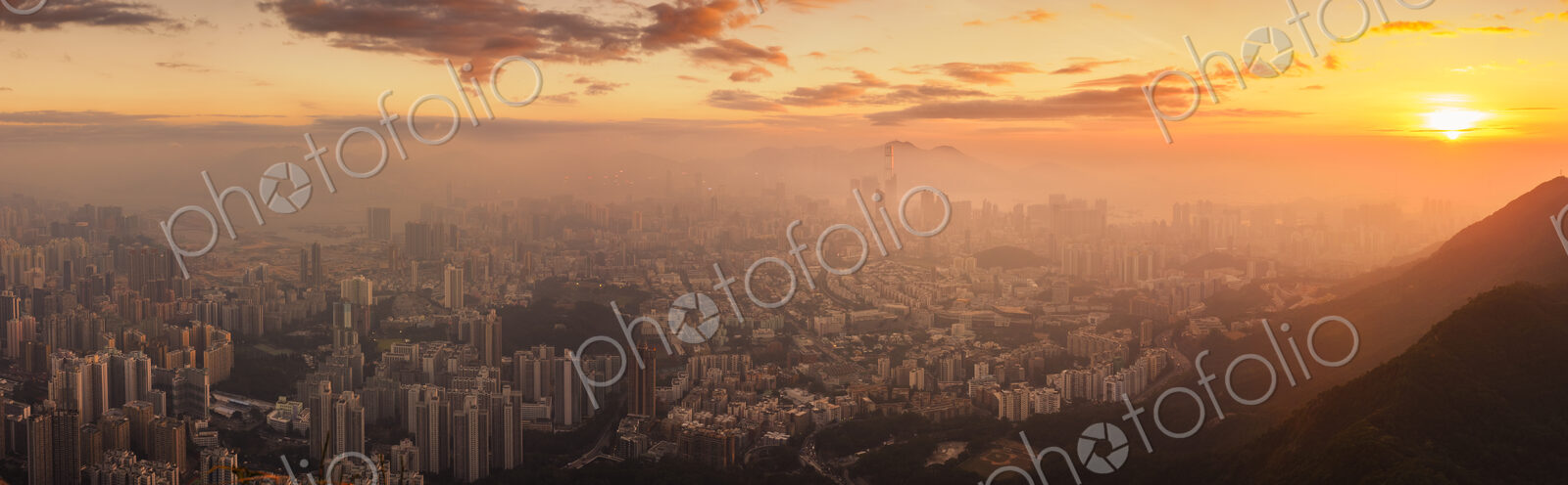 Hong Kong cityscape lit up at dawn.