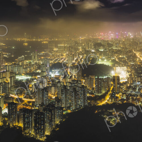 Hong Kong island seen from the hills, lit up at night.