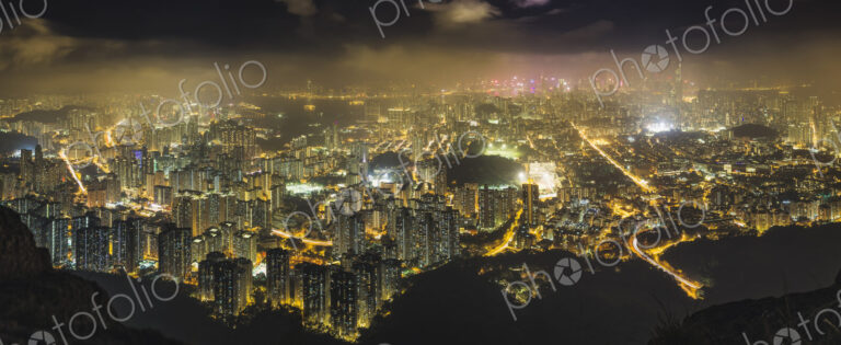 Hong Kong island seen from the hills, lit up at night.