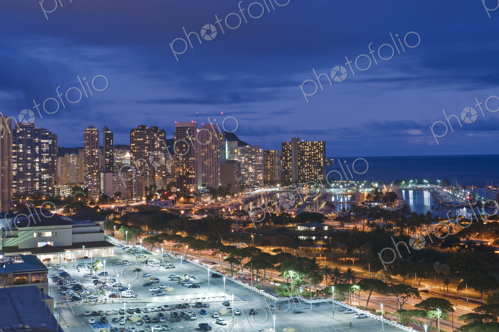 Honolulu, Waikiki, an elevated view of the downtown area and the waterfront at night.