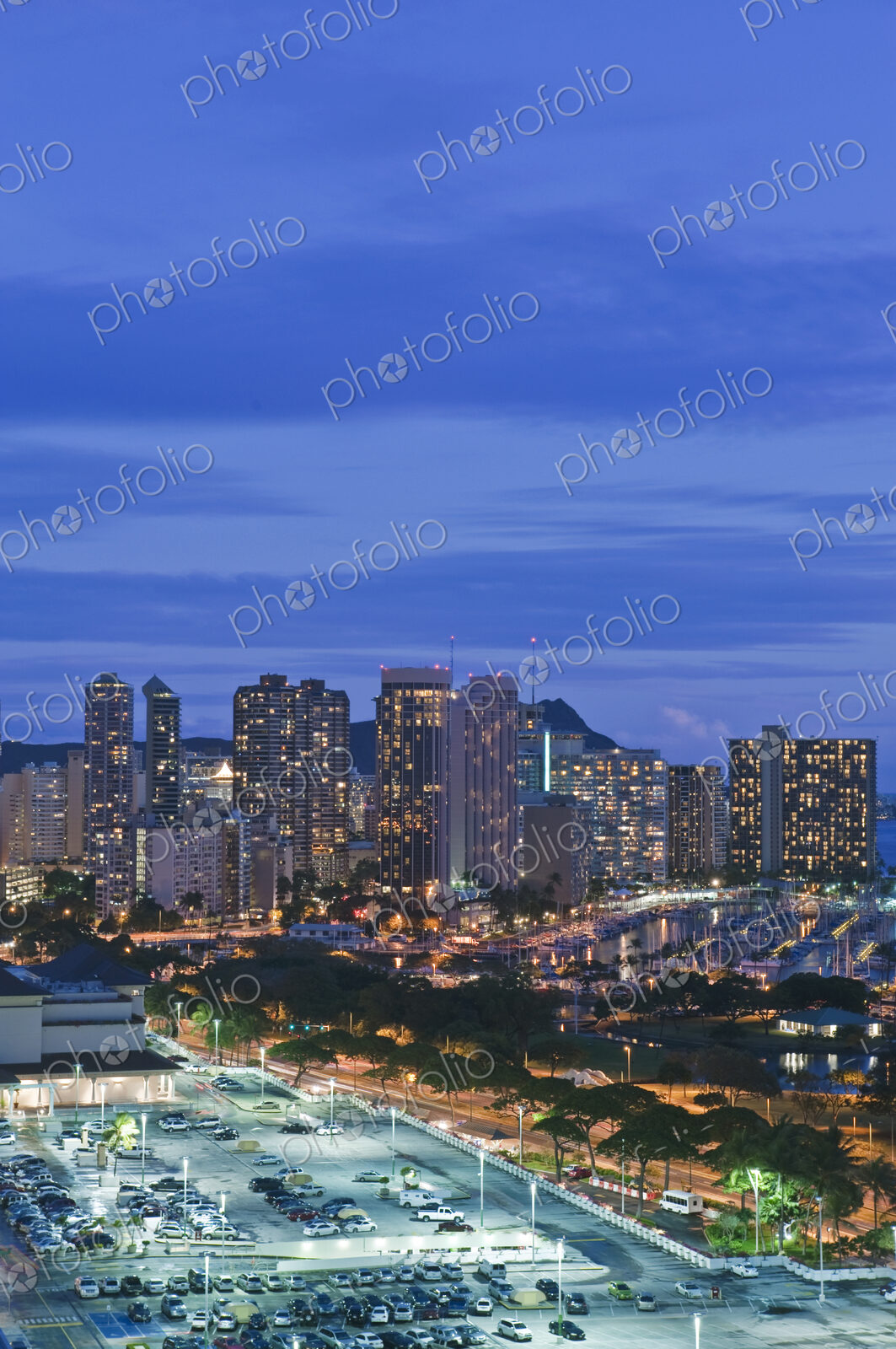 Honolulu, Waikiki, an elevated view of the downtown area and the waterfront at night.