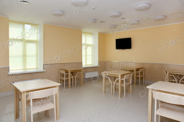 Hospital Room With Tables and Chairs