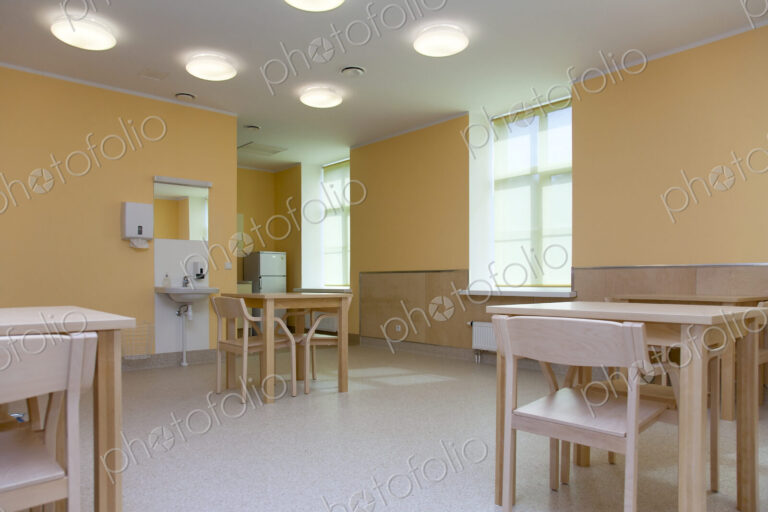 Hospital Room With Tables and Chairs