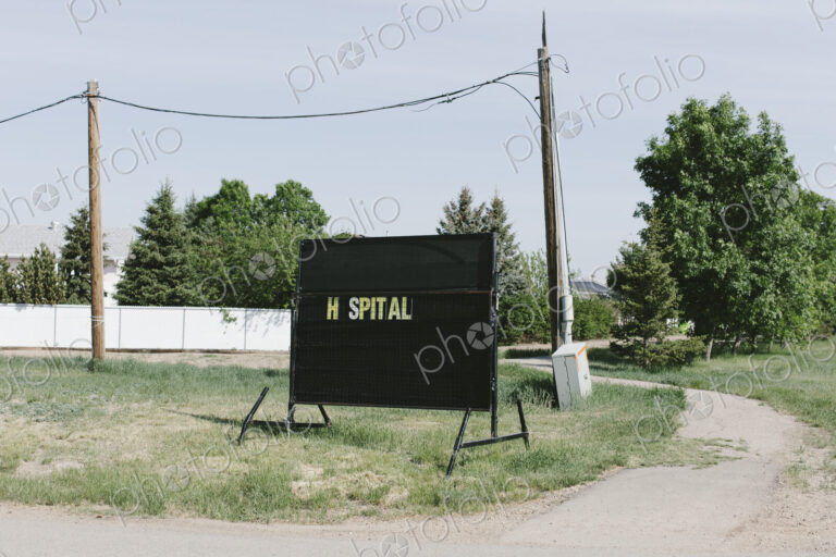 Hospital sign on small town street