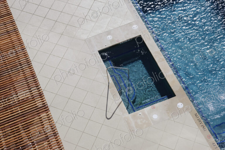 Hot Tub Next to Swimming Pool